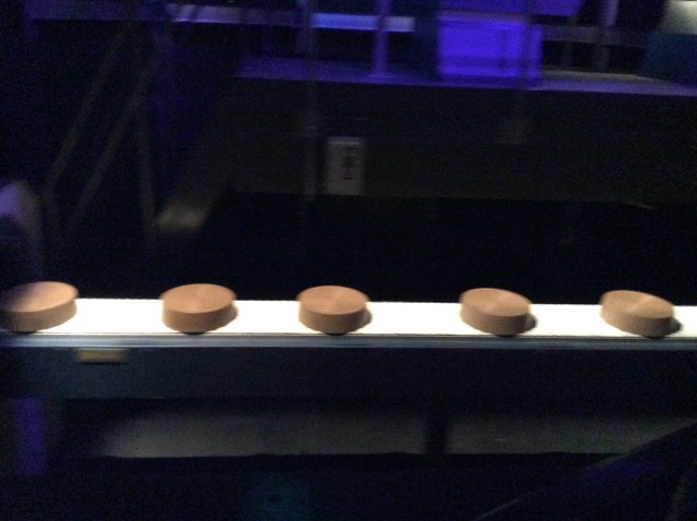 Photo of chocolate rolls on a conveyor belt